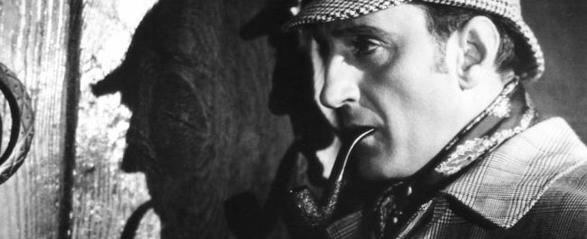 Basil Rathbone caracterizado de Sherlock Holmes.